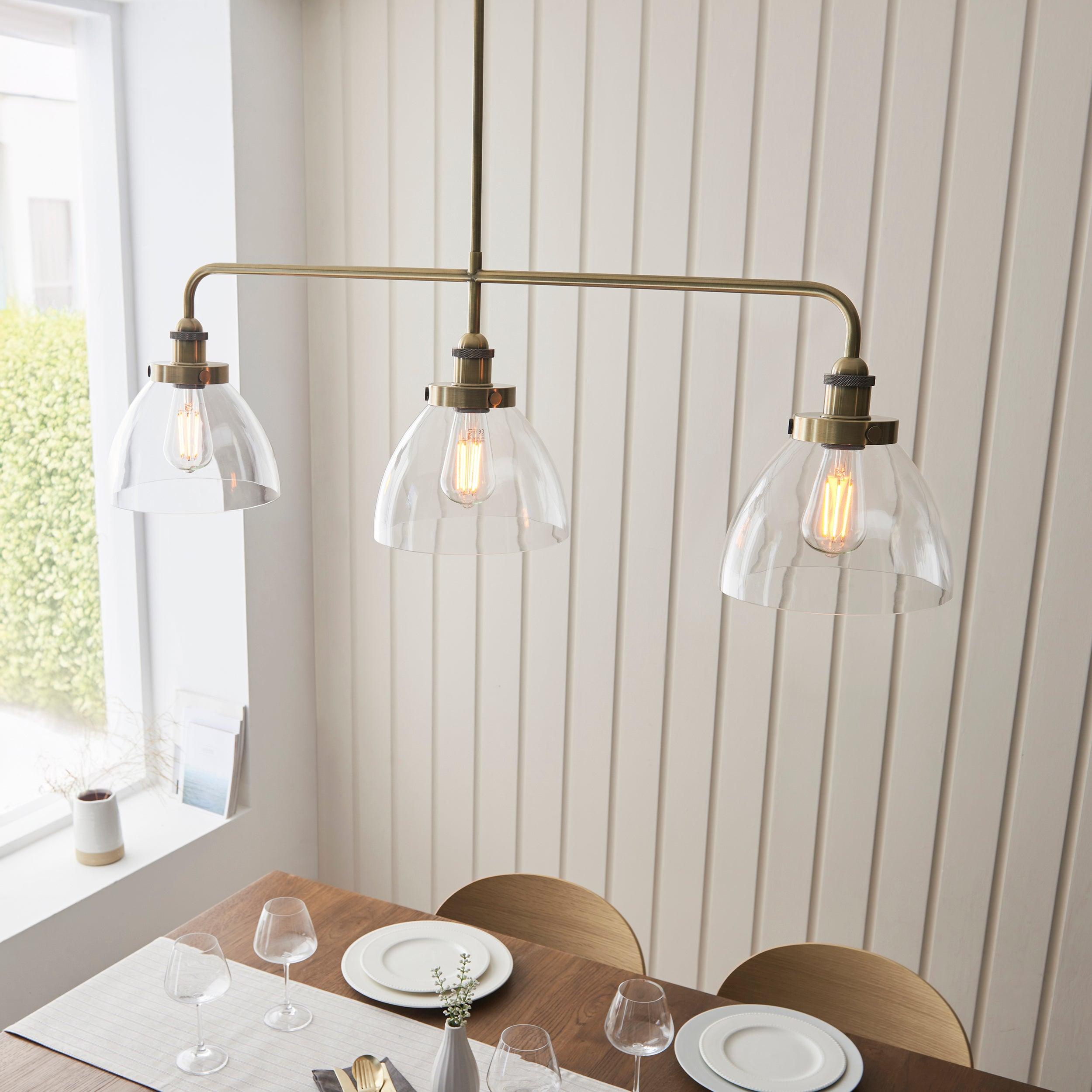 hansen linear 3 light brass pendant glass shades by Endon Lighting Bedroom Close Up Image
