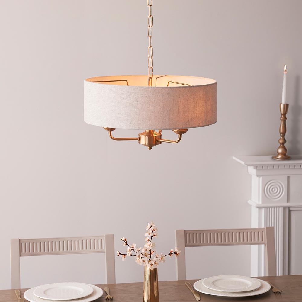 highclere aged brass 3 light pendant natural linen shade by Endon Lighting Living room image