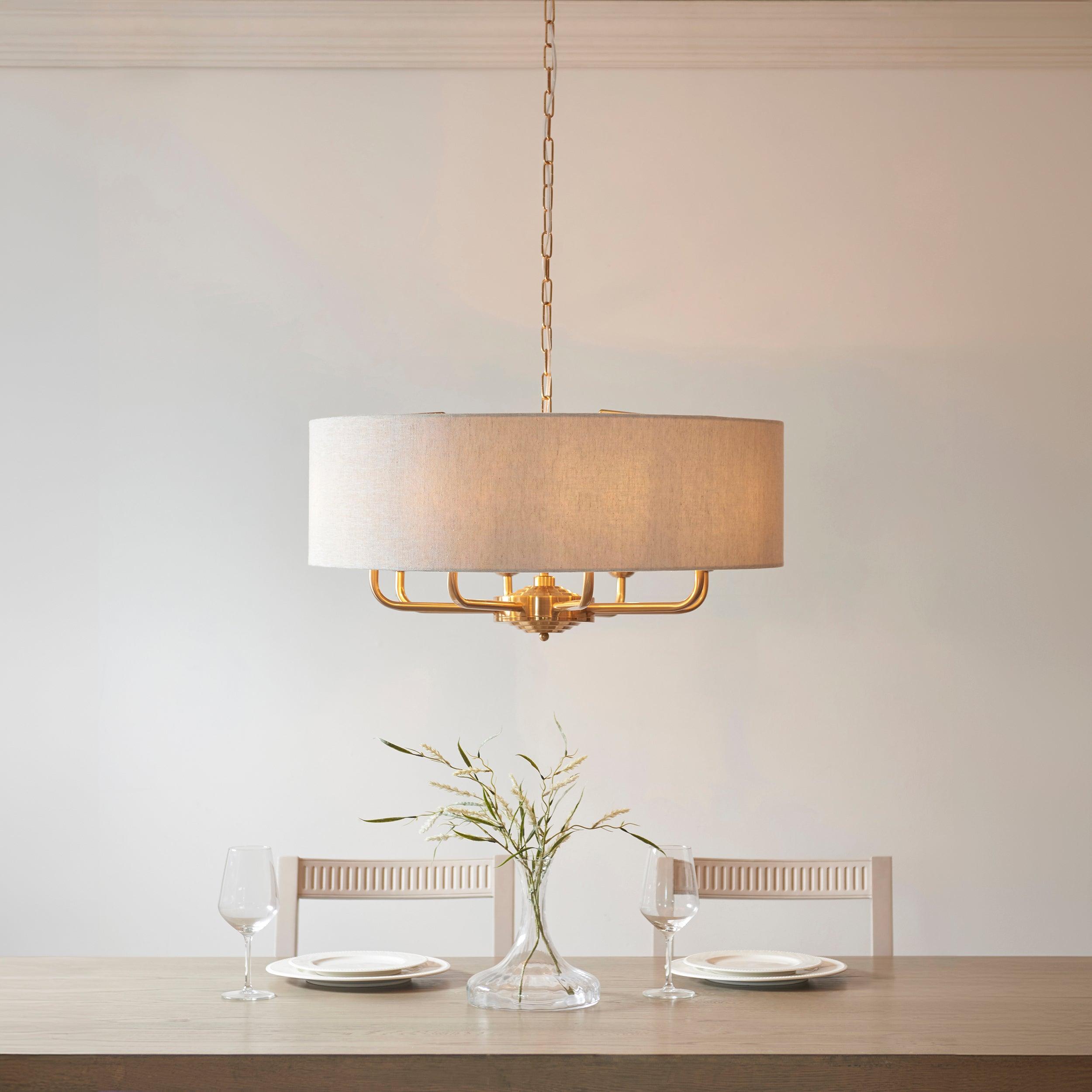 highclere vintage brass 8 light pendant linen shade by Endon Lighting Living room close up image