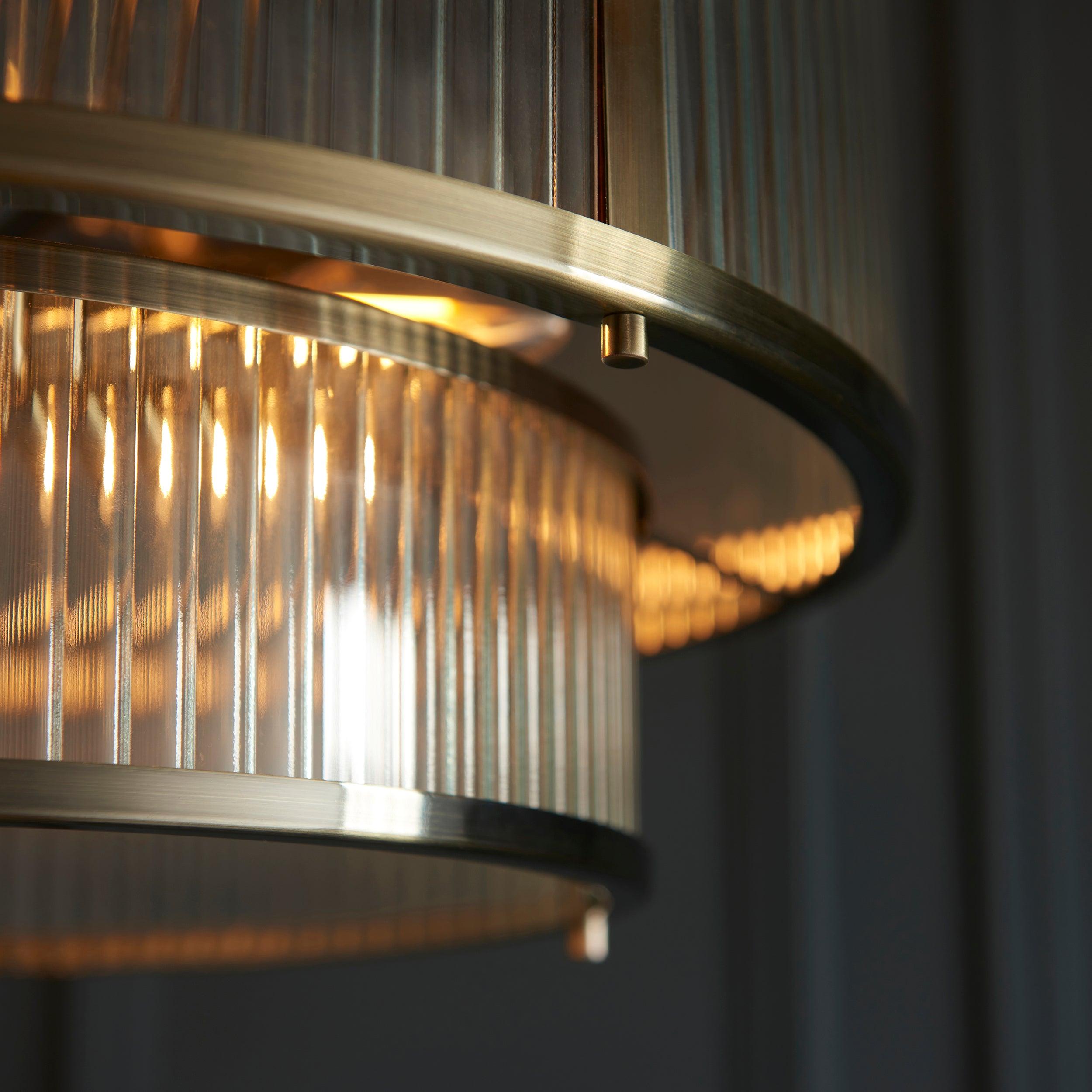 ridgeton 5 light brass ribbed shade glass pendant by Endon Lighting Bedroom Close Up Image