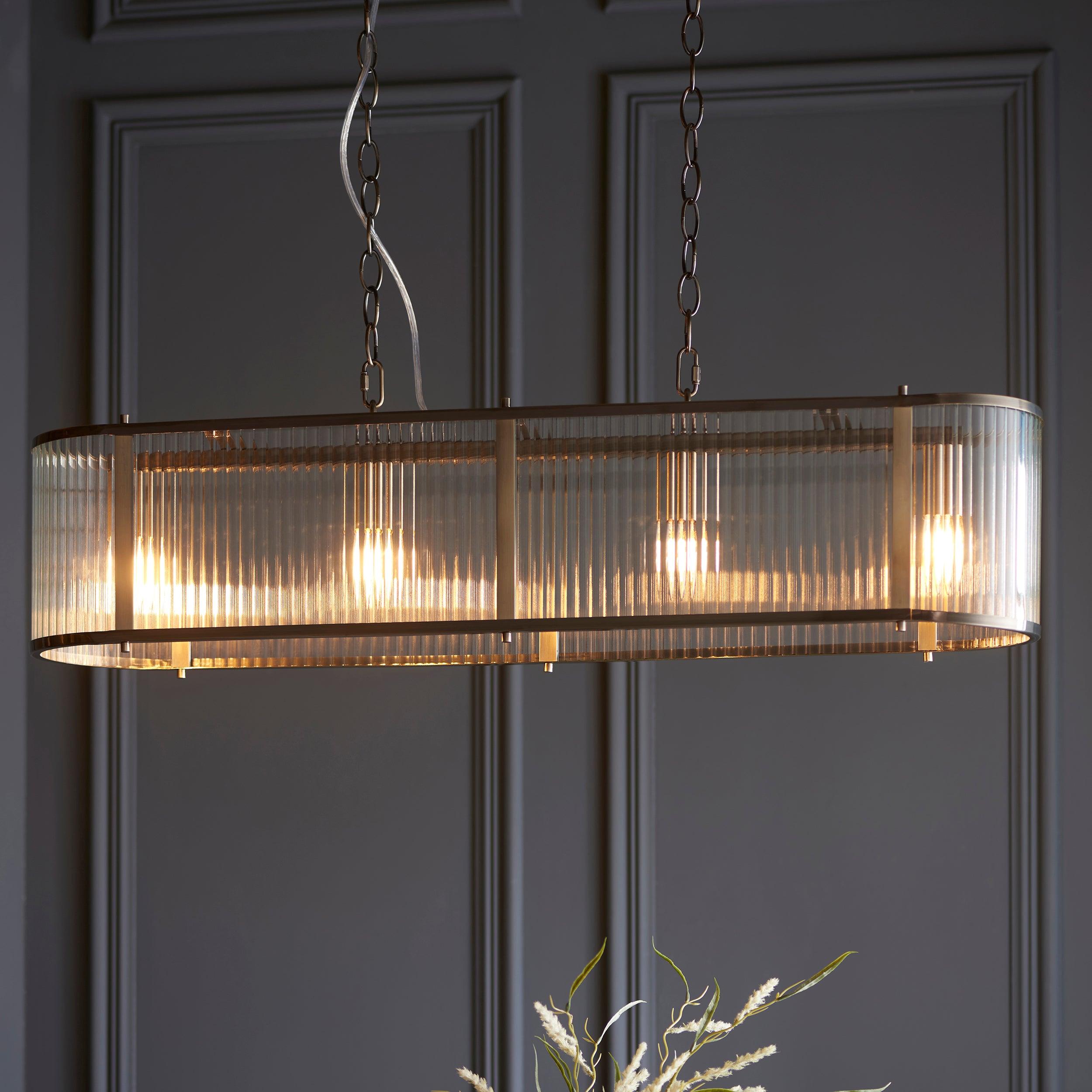 ridgeton 4 light brass ribbed shade glass linear pendant by Endon Lighting Living Room Family Shot