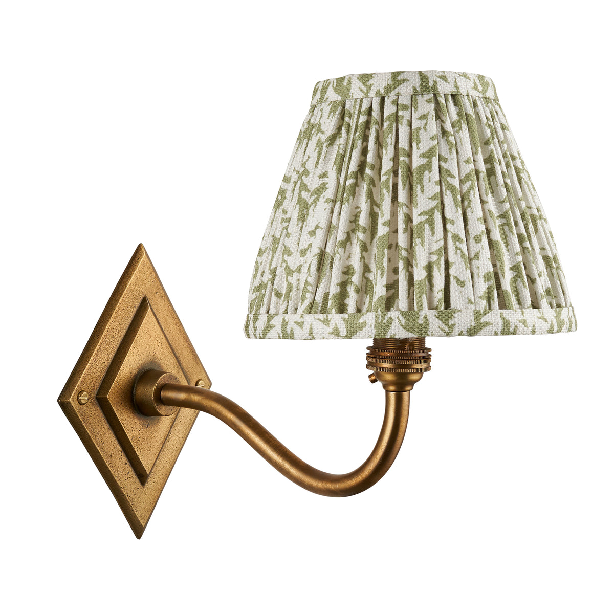 Diamond Curve antique brass wall light with green leaf pleated shade on a white background