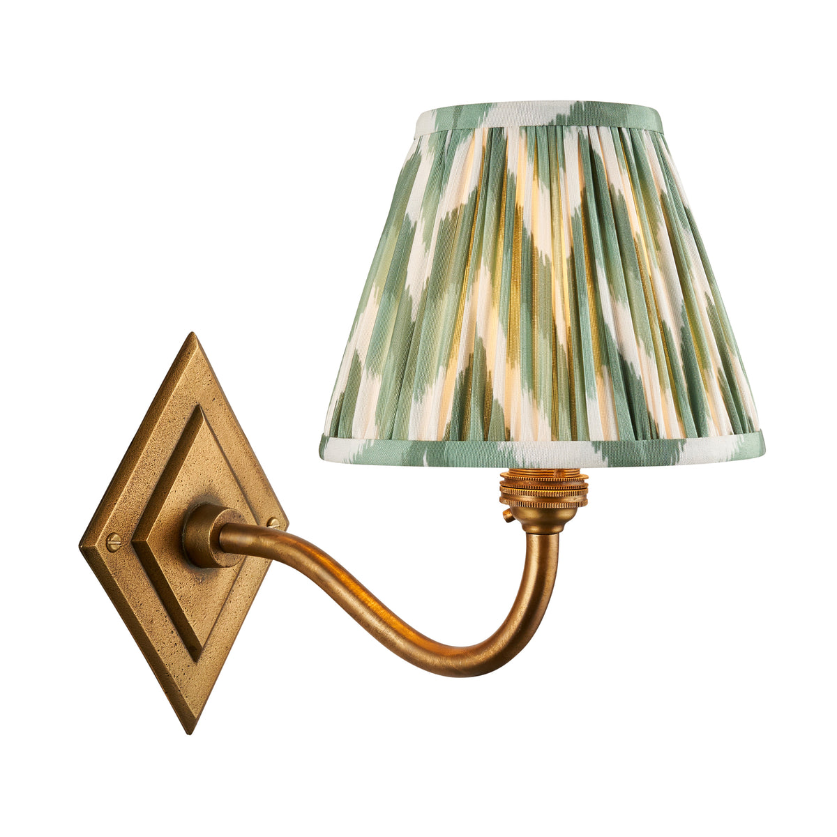 Diamond Curve antique brass wall light with a pleated green zigzag ikat shade on a diamond backplate