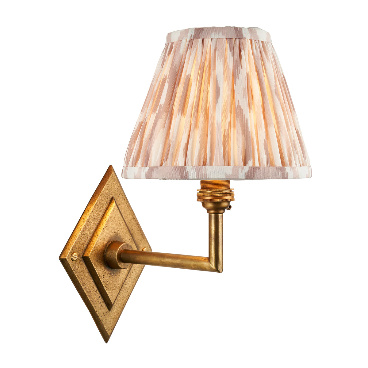 Diamond Angle brass wall light with a pleated natural ikat shade in soft beige and cream