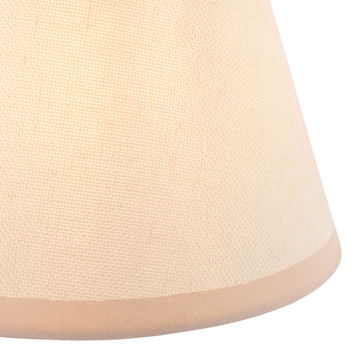 Close-up of the vintage white woven fabric shade with a neat trimmed lower edge