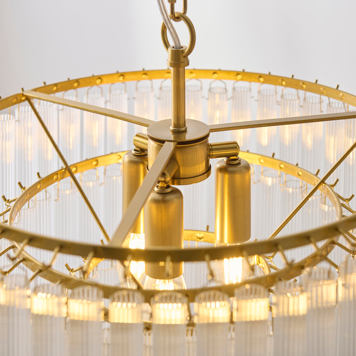 Interior view of the Montpellier chandelier showing brass lampholders and glowing bulbs