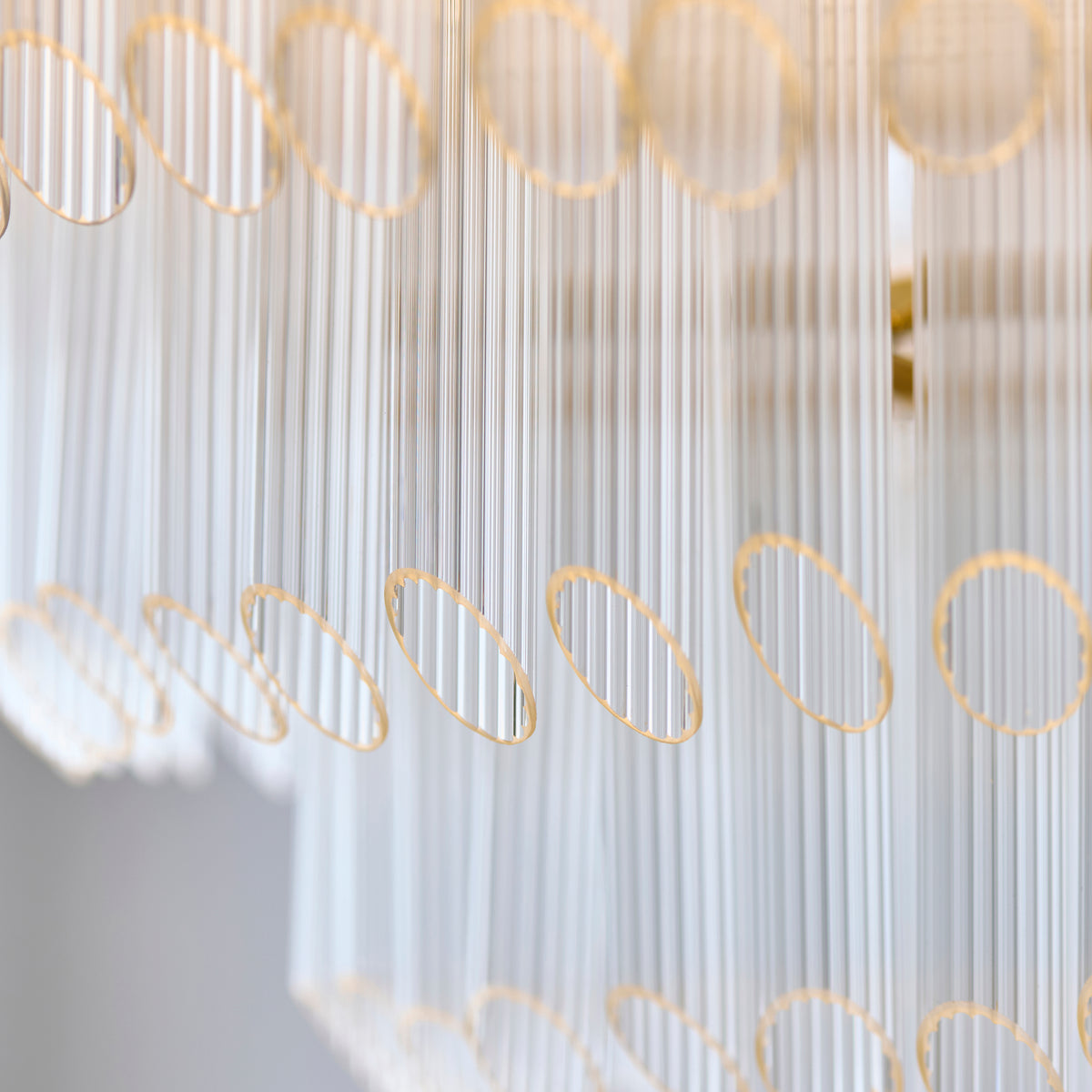 Underside of the Montpellier chandelier showing brass frame, lamps and ribbed glass rods