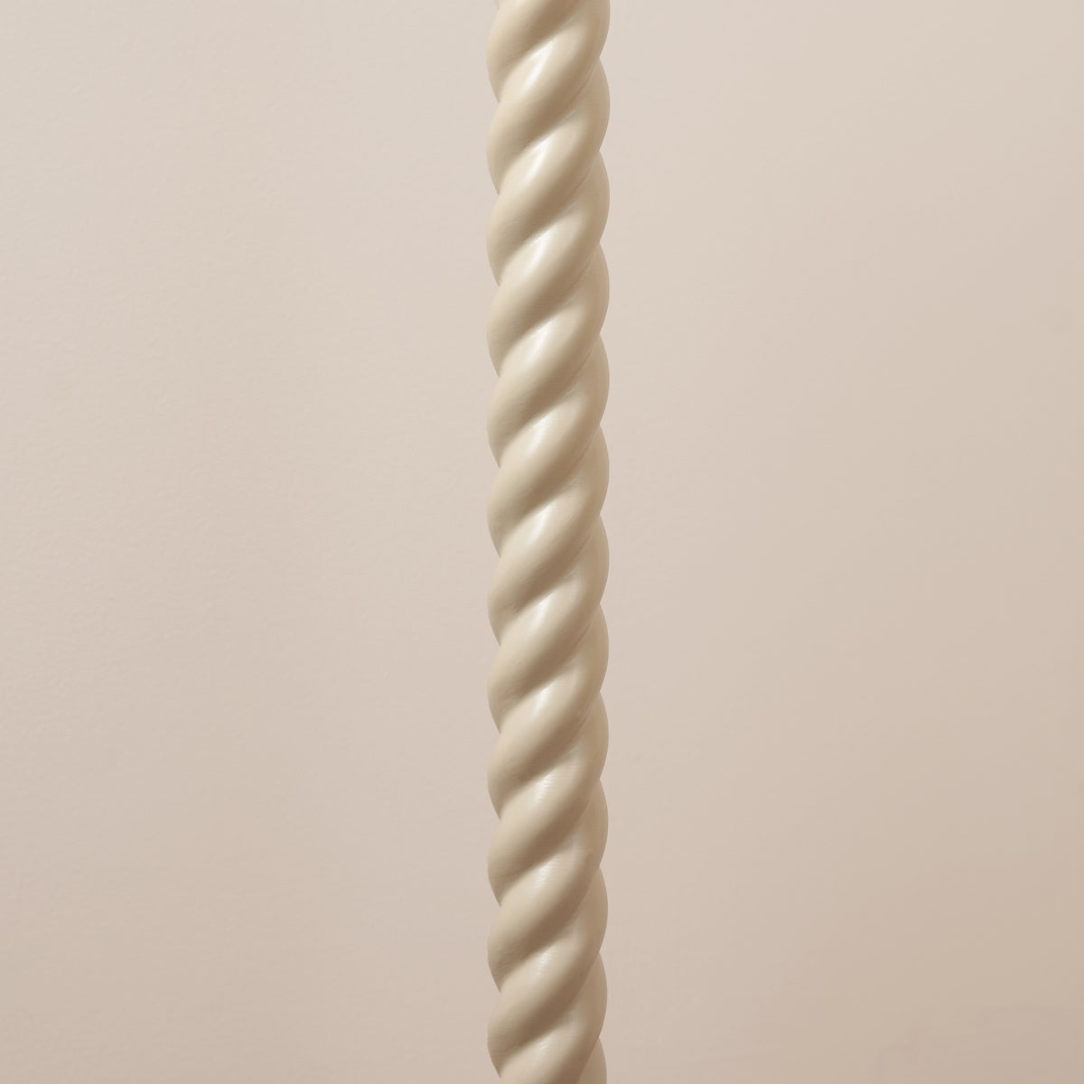Detail of the spiralled satin almond white stem of the Twist floor lamp base