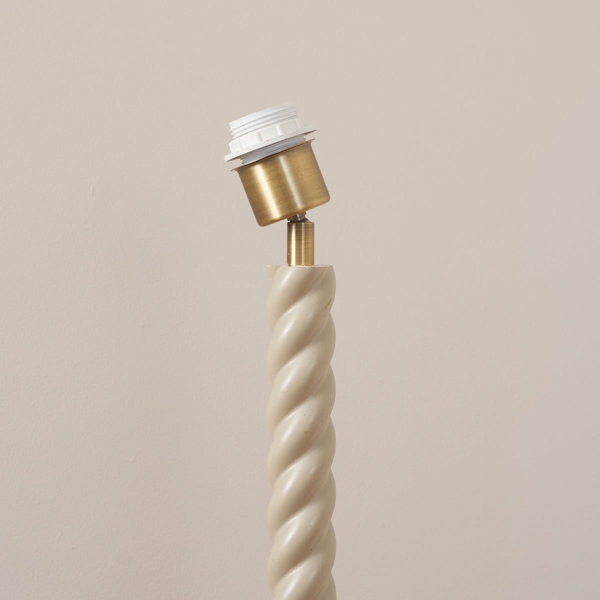 Twist floor lamp base's brass bulb holder and shade fitting shown in close detail
