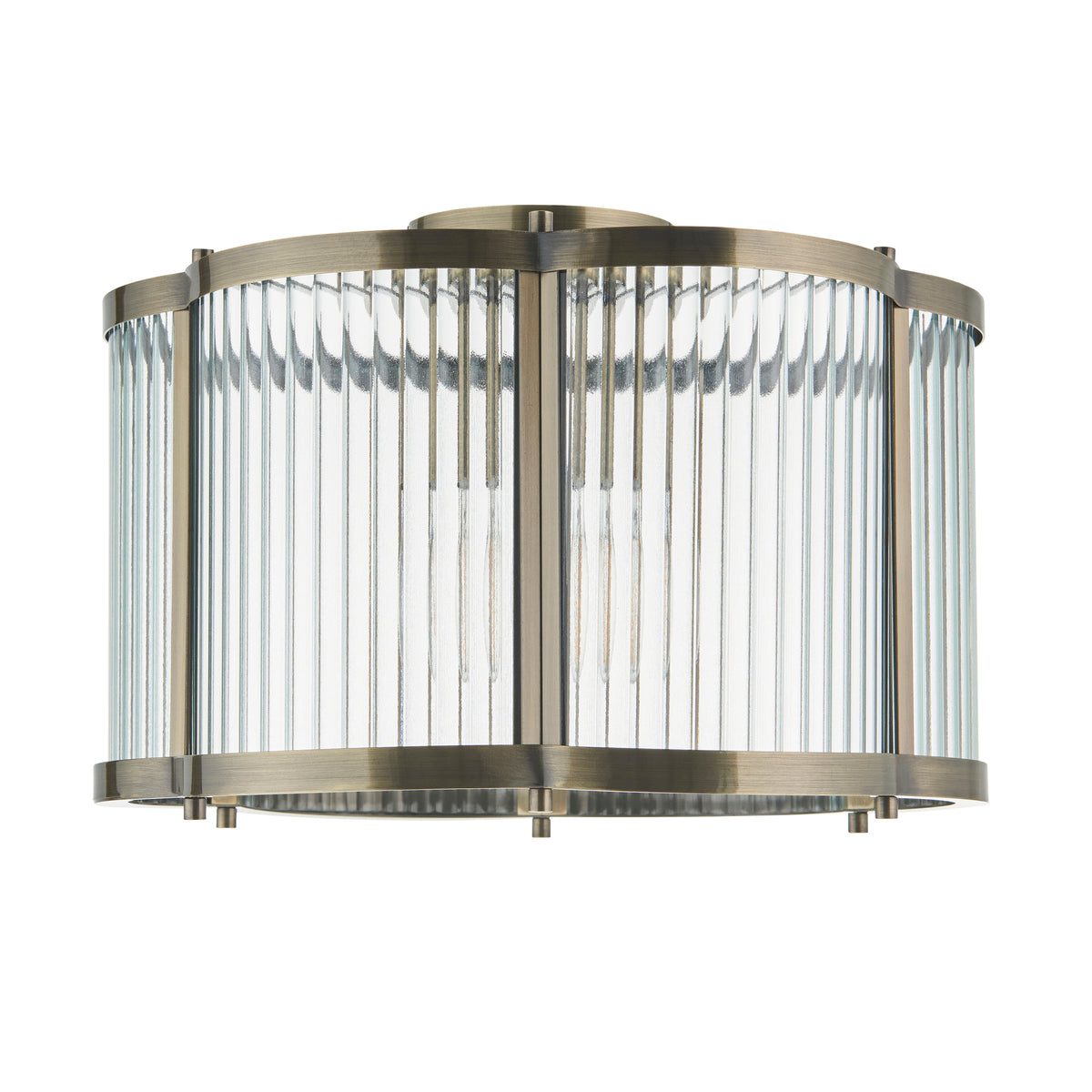 Ridgeton Scallop antique brass flush ceiling light with ribbed glass, lit on a plain background
