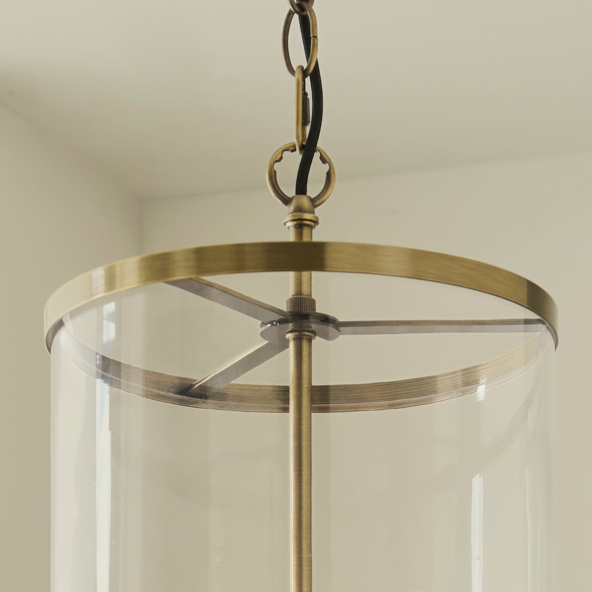 Detail of the Hebden pendant's brass chain, top ring and clear glass cylinder shade