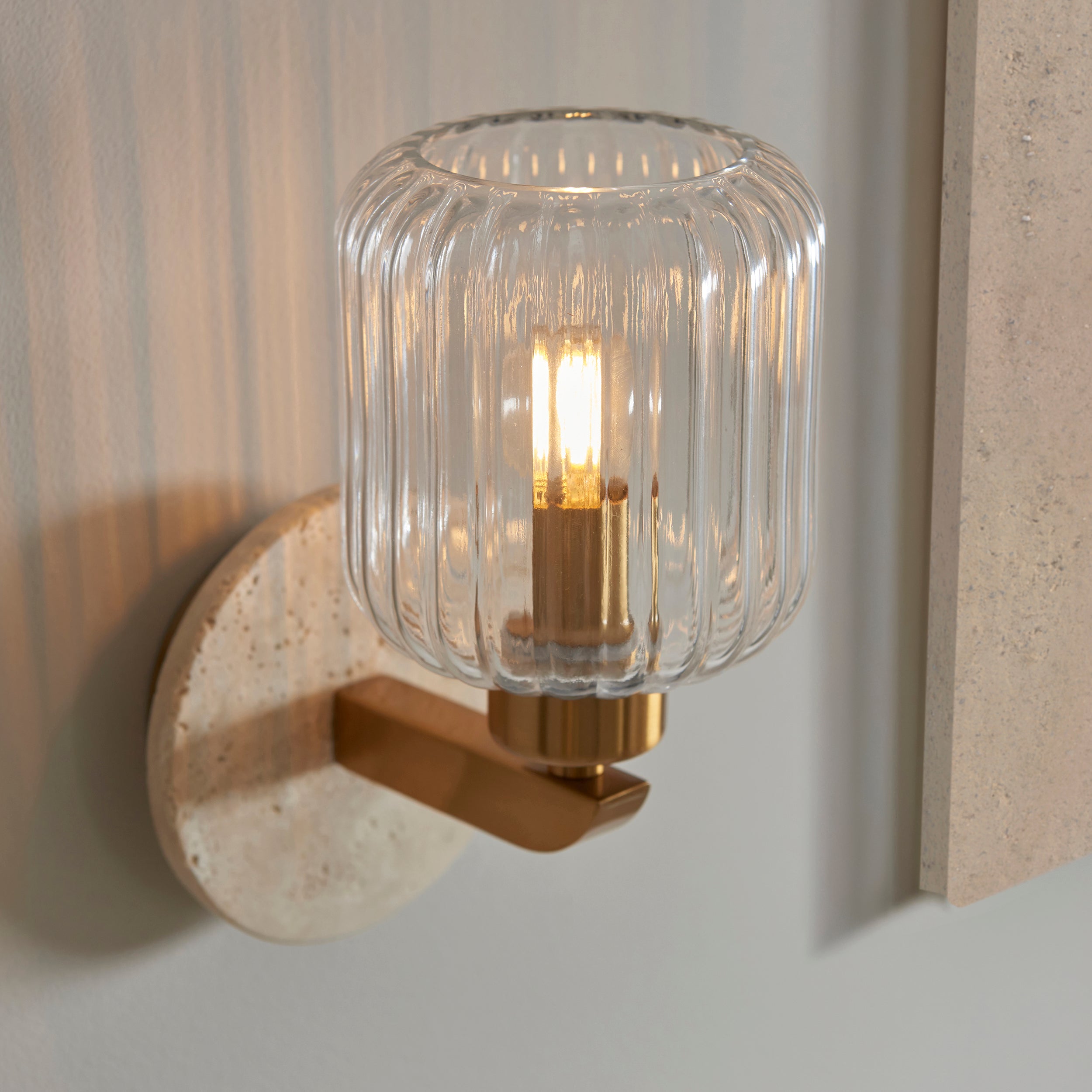 Travi Travertine Stone & Brass Wall Light - Glass Ribbed Shade