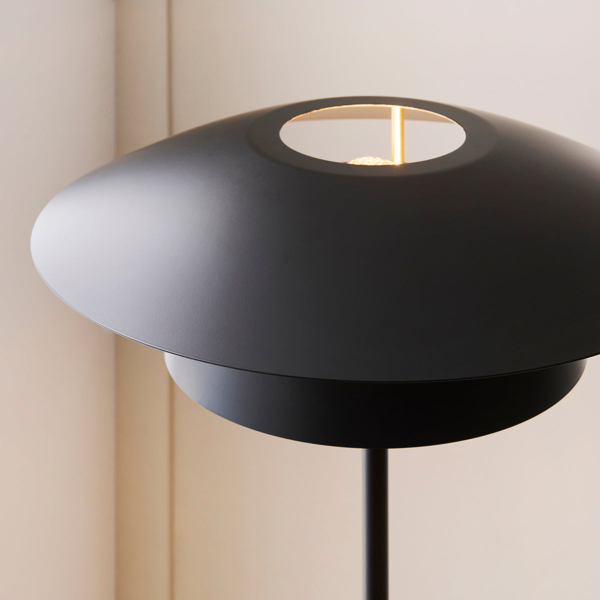 Detail of the Lyon shade's circular top aperture revealing the lamp inside