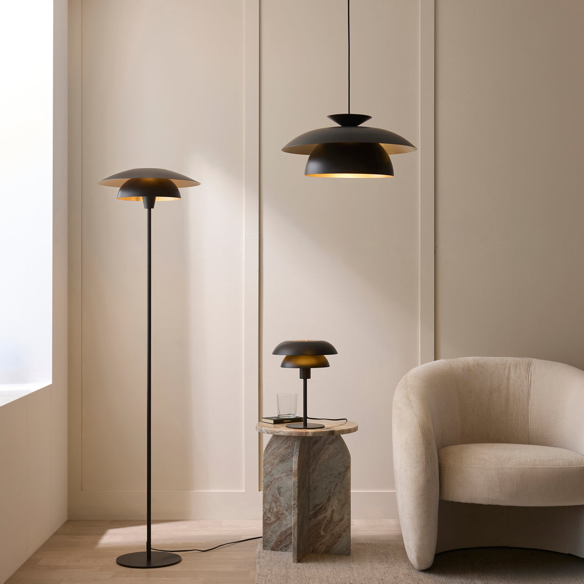 Lyon black and brass floor lamp, pendant and table lamp together in a panelled living room