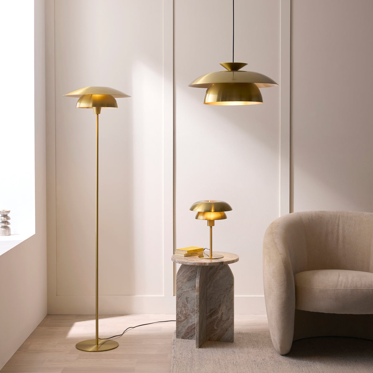 Lyon satin brass pendant with matching floor and table lamps in a panelled living room
