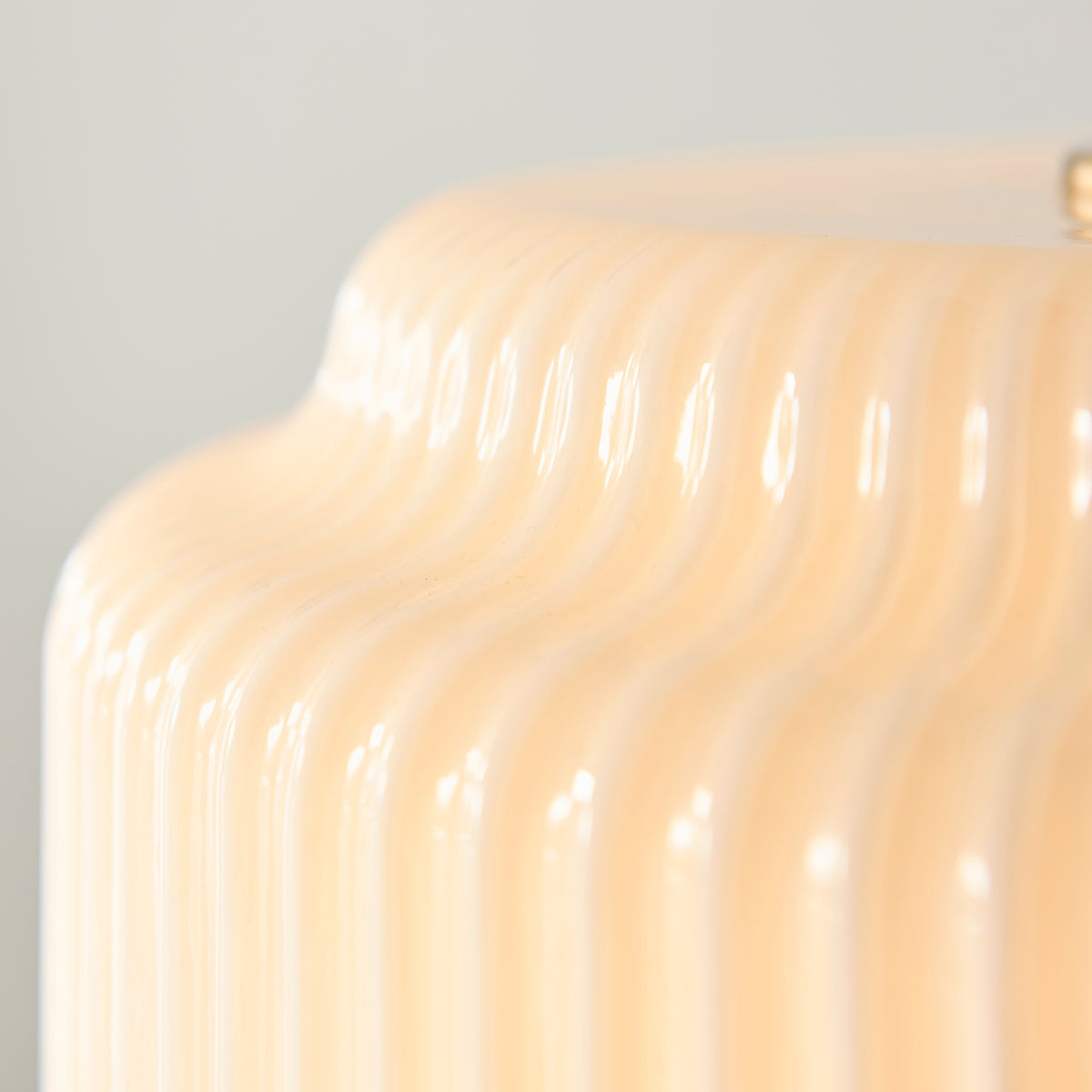 Macro detail of the ribbed opal glass profile on the Evora pendant shade