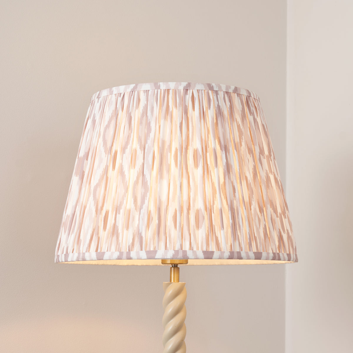 Close-up of the pleated neutral ikat shade in soft beige and white tones