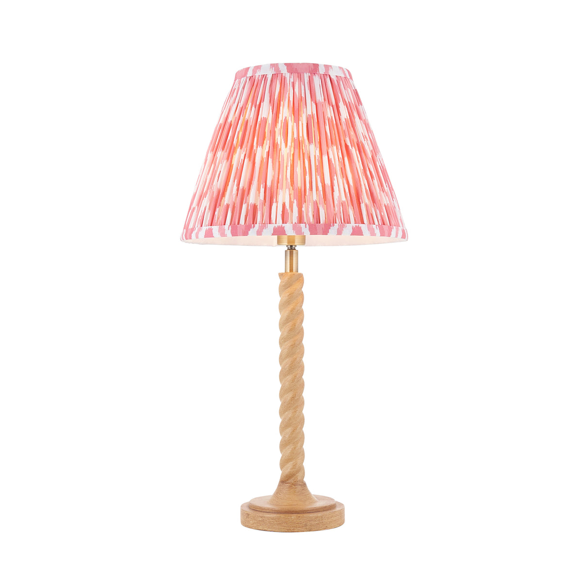 Twist & Ikat oak effect table lamp with twisted stem and pleated coral pink ikat shade
