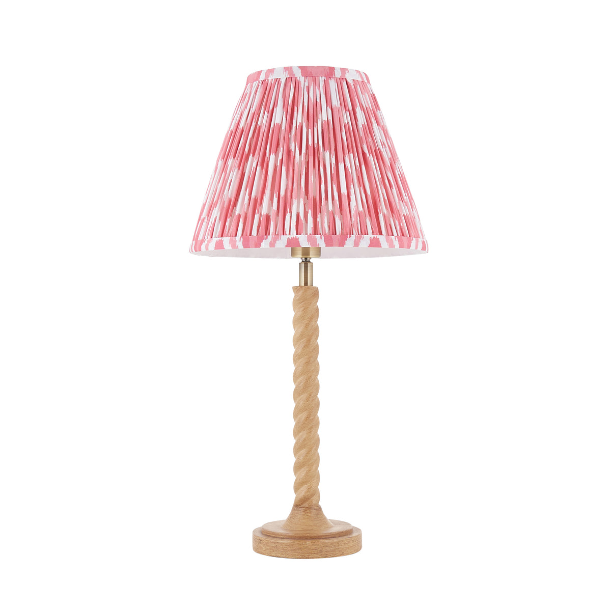 Twist & Ikat oak effect table lamp complete with coral pink pleated ikat shade