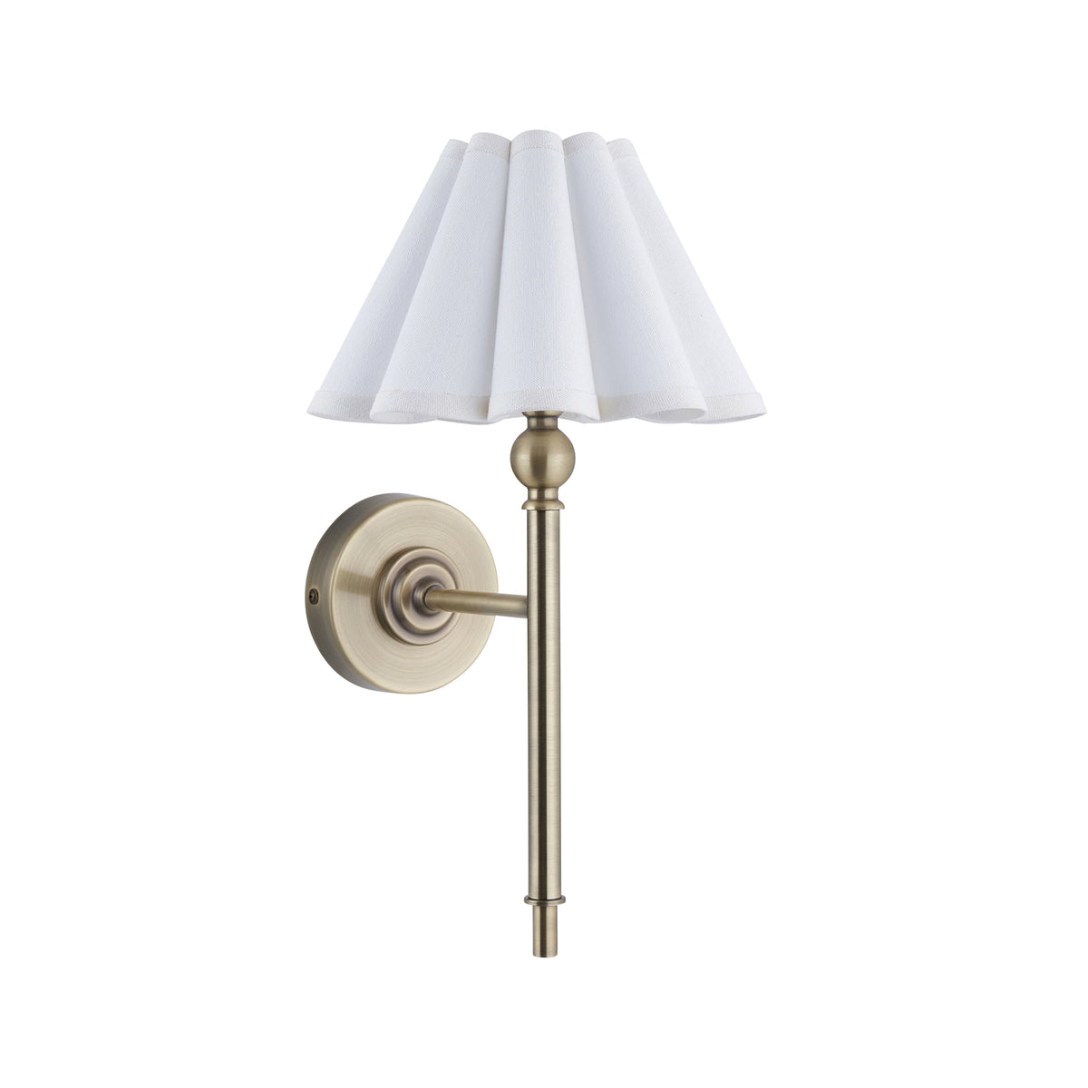 Sylvie antique brass wall light with white scalloped shade shown unlit against white