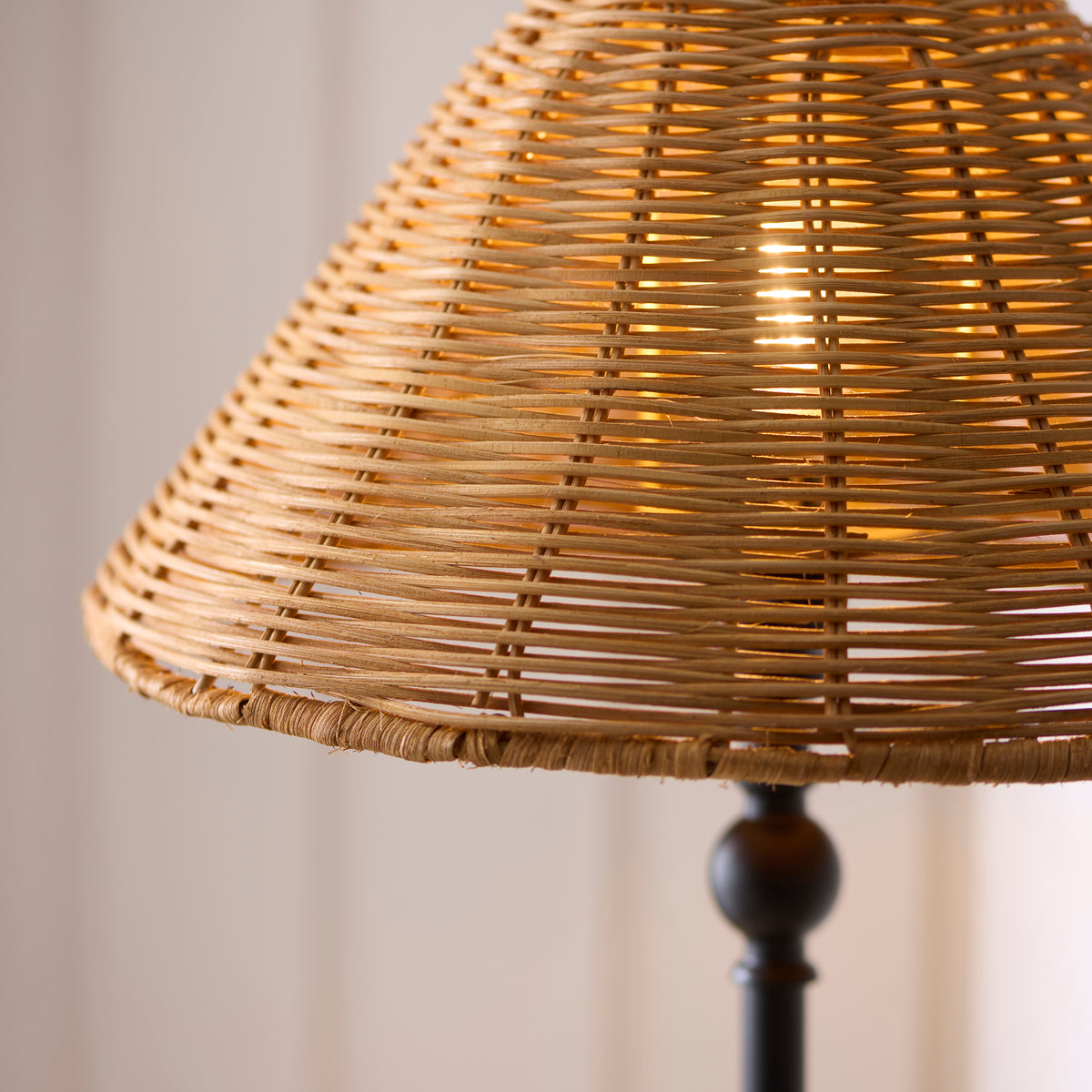 Detail of the Jericho lamp's woven rattan shade with warm light through the weave