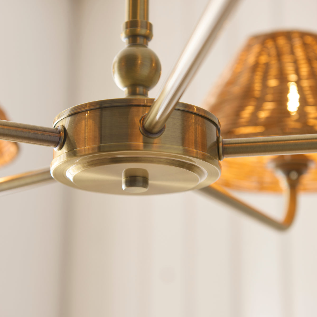 Underside detail of the Jericho chandelier's brass hub and arms