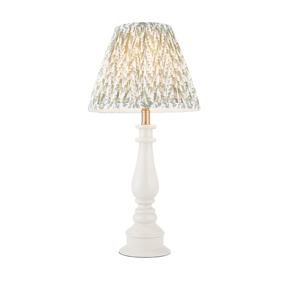 Myrtle almond white turned table lamp with pleated green leaf-print empire shade, lit