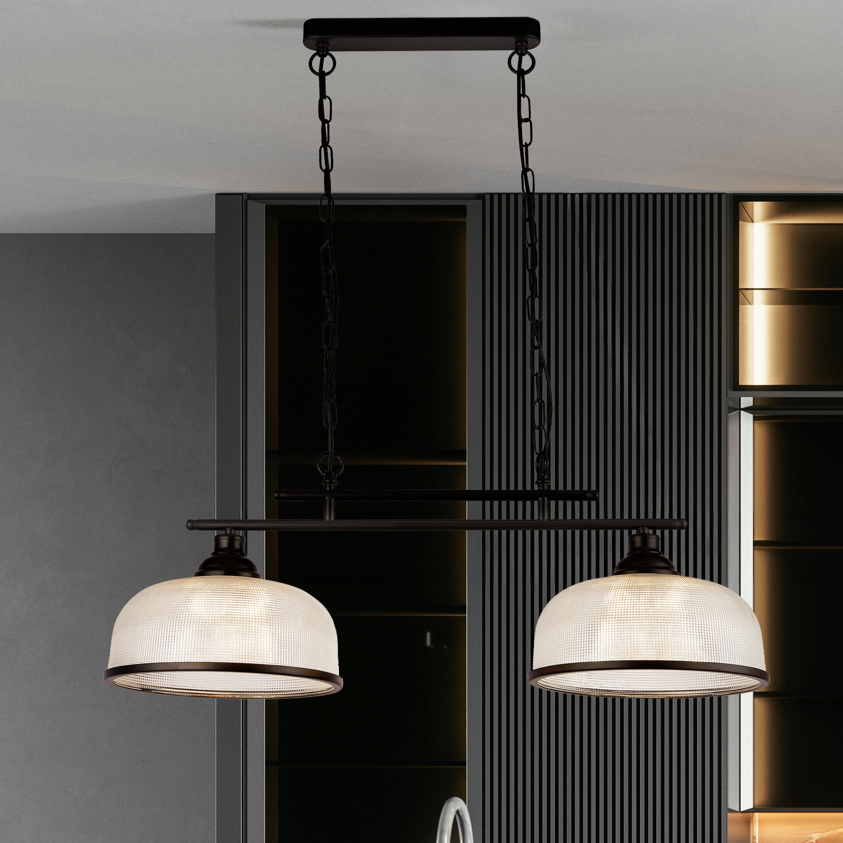 Modern kitchen with pendant lights, faucet, and metallic backsplash.