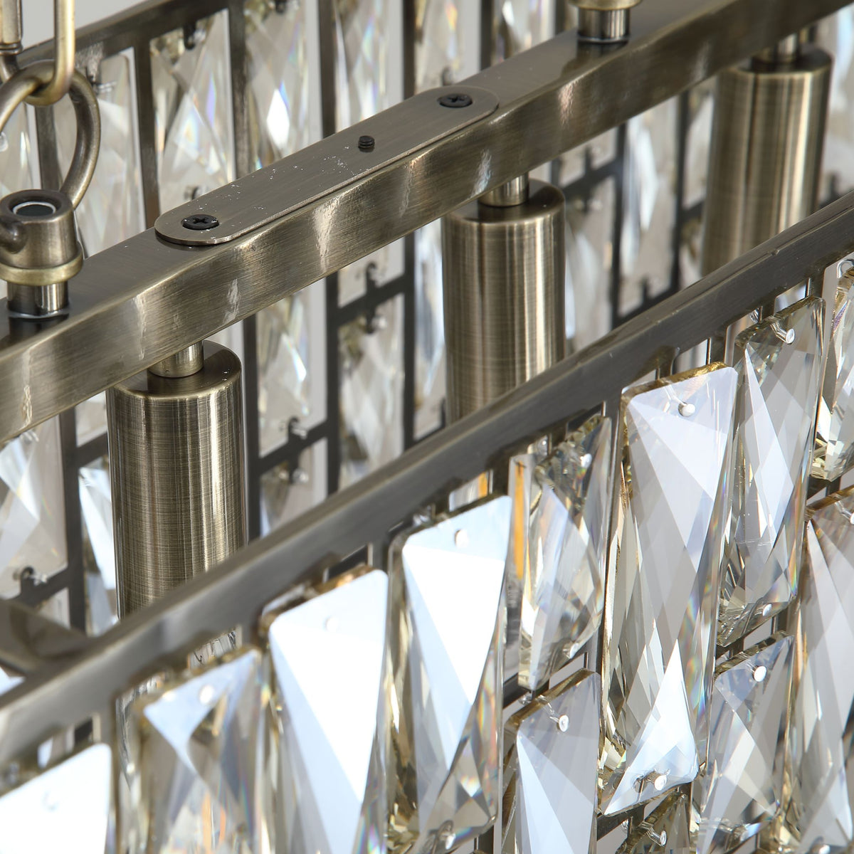 Detail of the Bijou pendant's brass frame lamp holders and faceted glass tiles