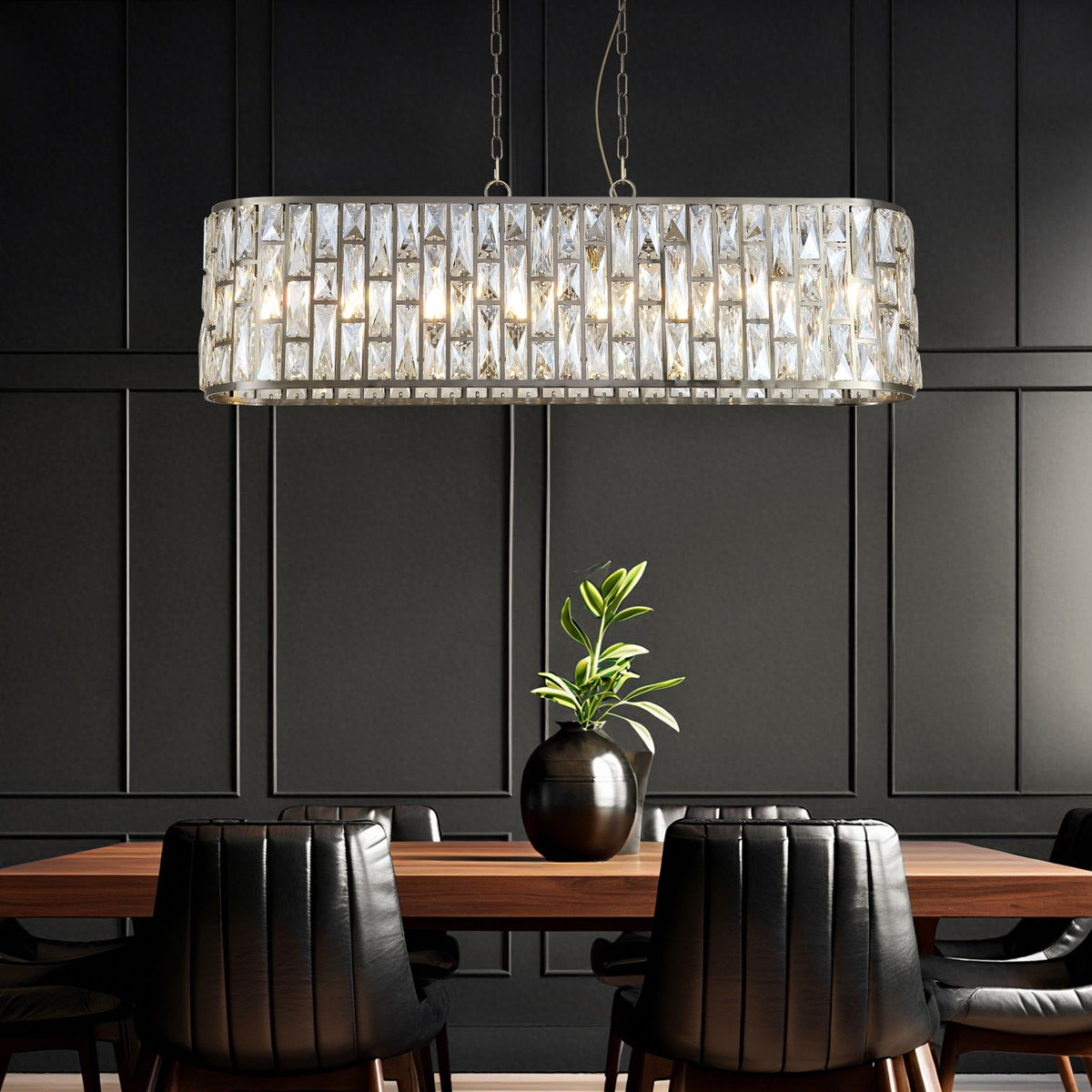 Dark panelled dining room with the Bijou brass pendant over a wood table and black chairs
