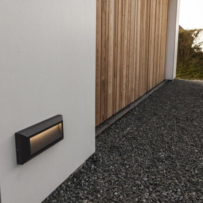 Lutec Helena Outdoor Grey LED Wall Light 5191602118 fixed outside a garage door