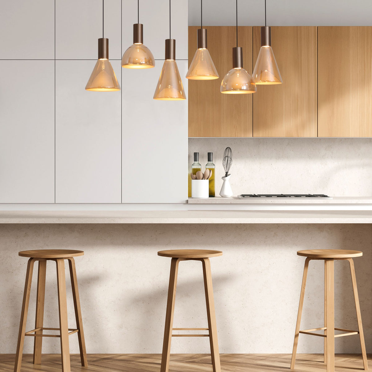 Cannes amber pendants lit above a kitchen breakfast bar with oak units and wooden stools