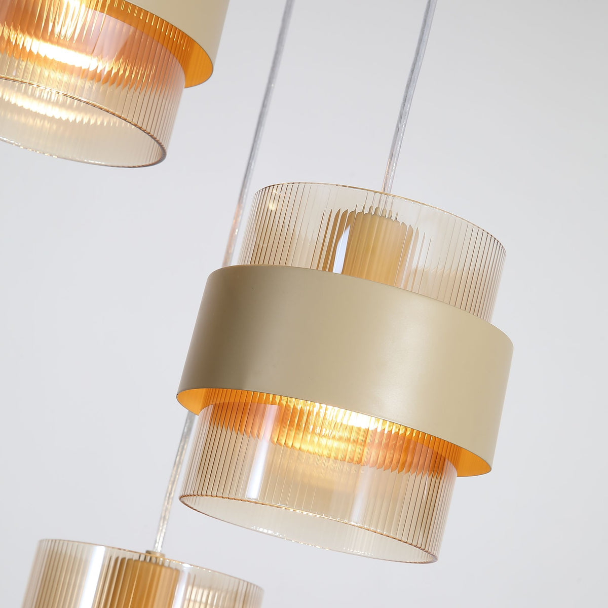 Close-up of the Royal pendant's sand painted band and ribbed amber glass cylinder