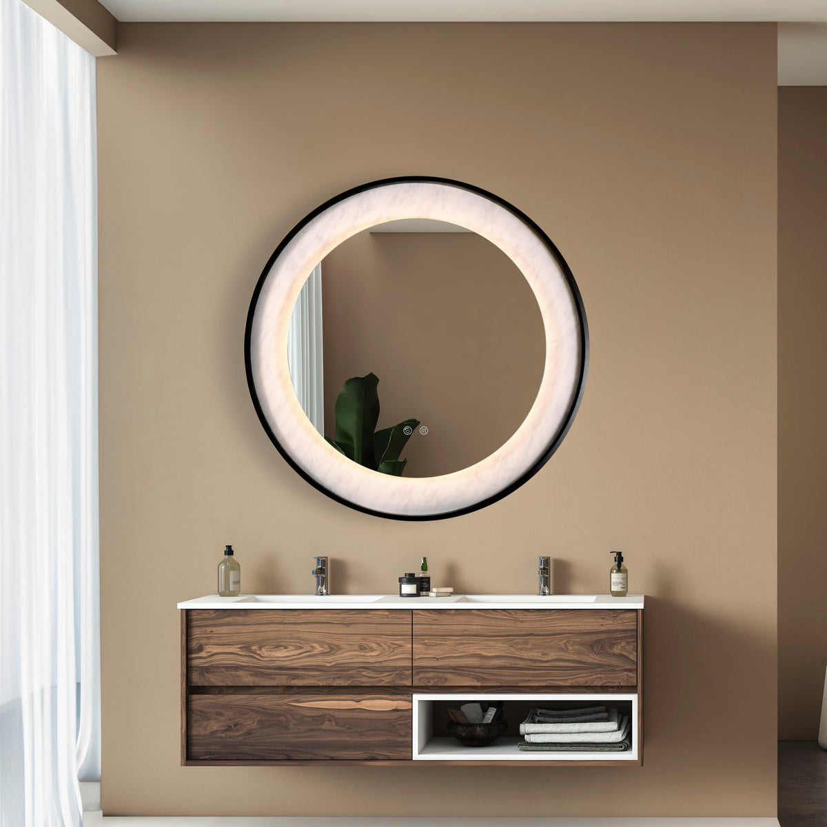 Luxo round lit mirror above a walnut double vanity unit in a warm neutral bathroom