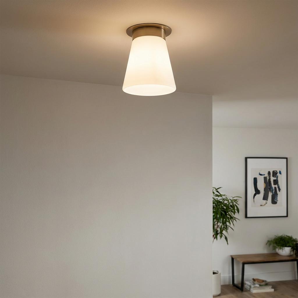 Albers bronze flush ceiling light with a frosted white conical shade mounted on a white ceiling.