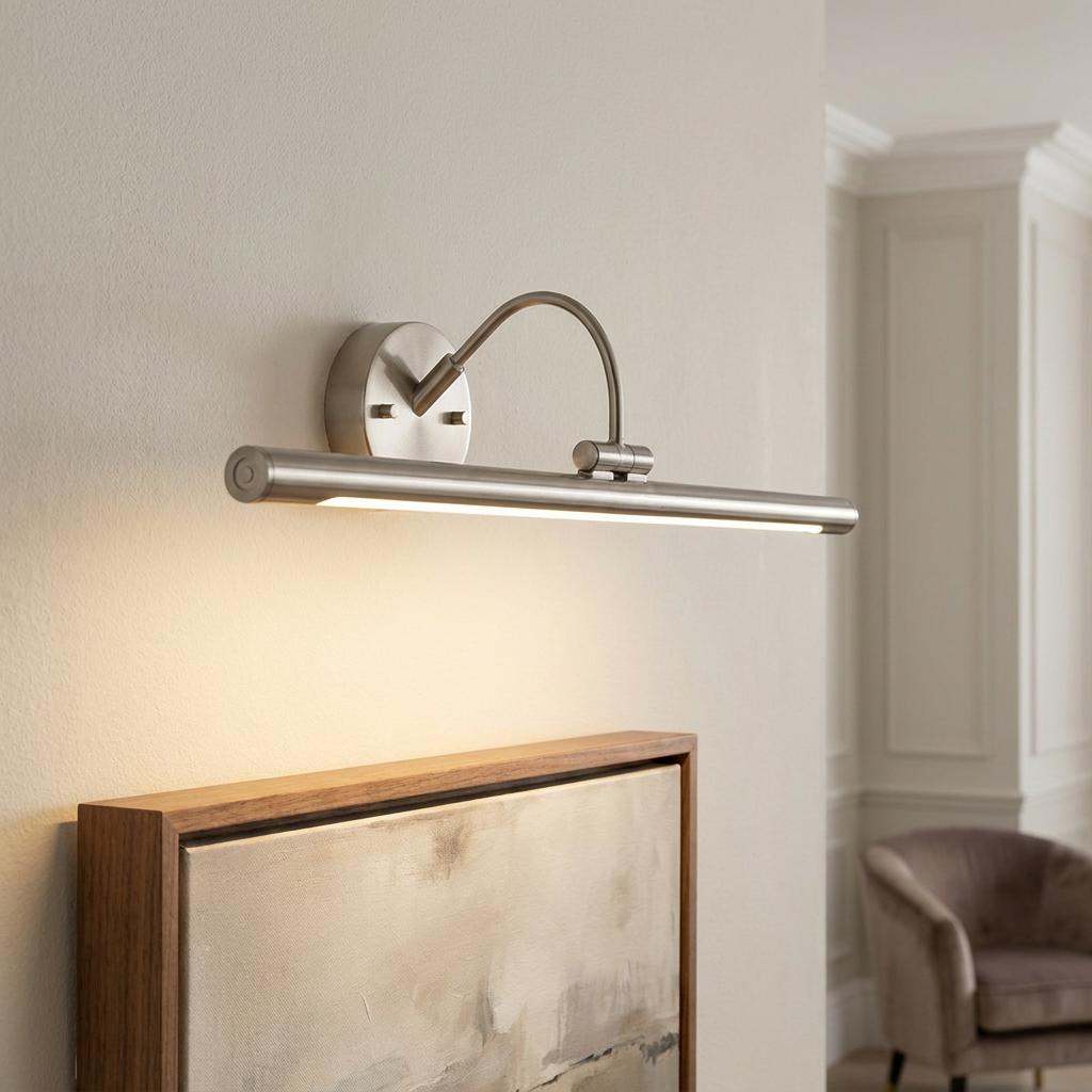 Brushed nickel Alton 1 Light LED picture light illuminating an abstract painting in a modern interior setting.