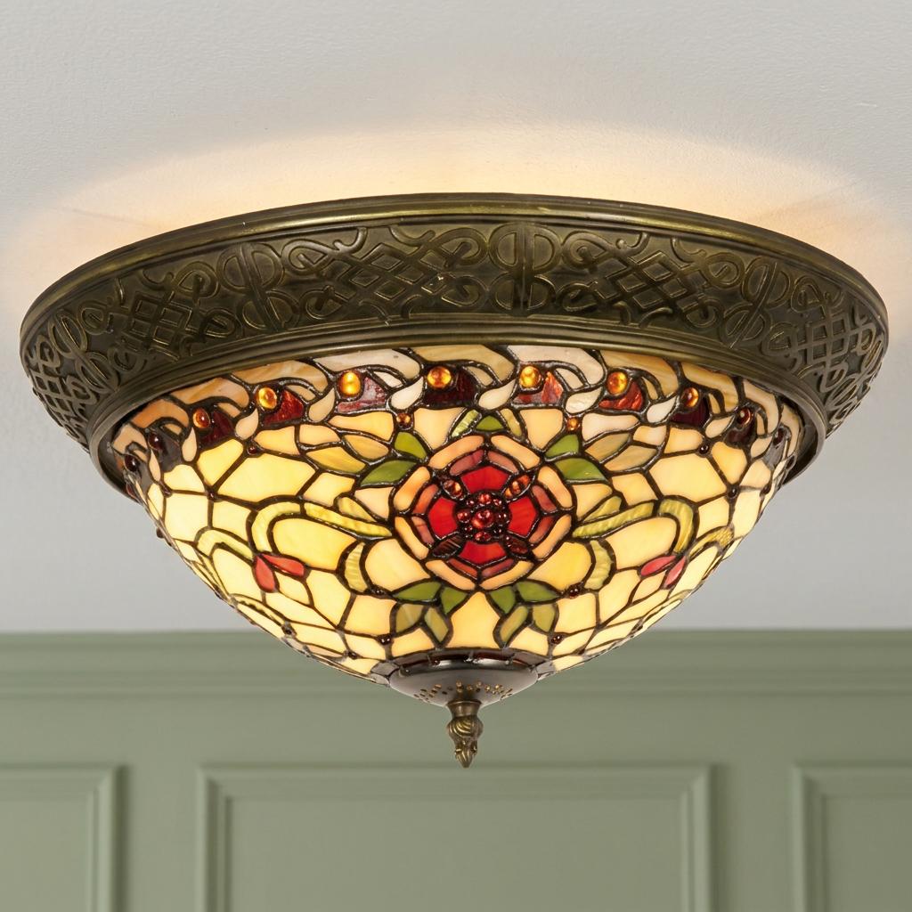 Ornate Tiffany-style flush ceiling light with red rose stained glass and intricate bronze patterned rim.