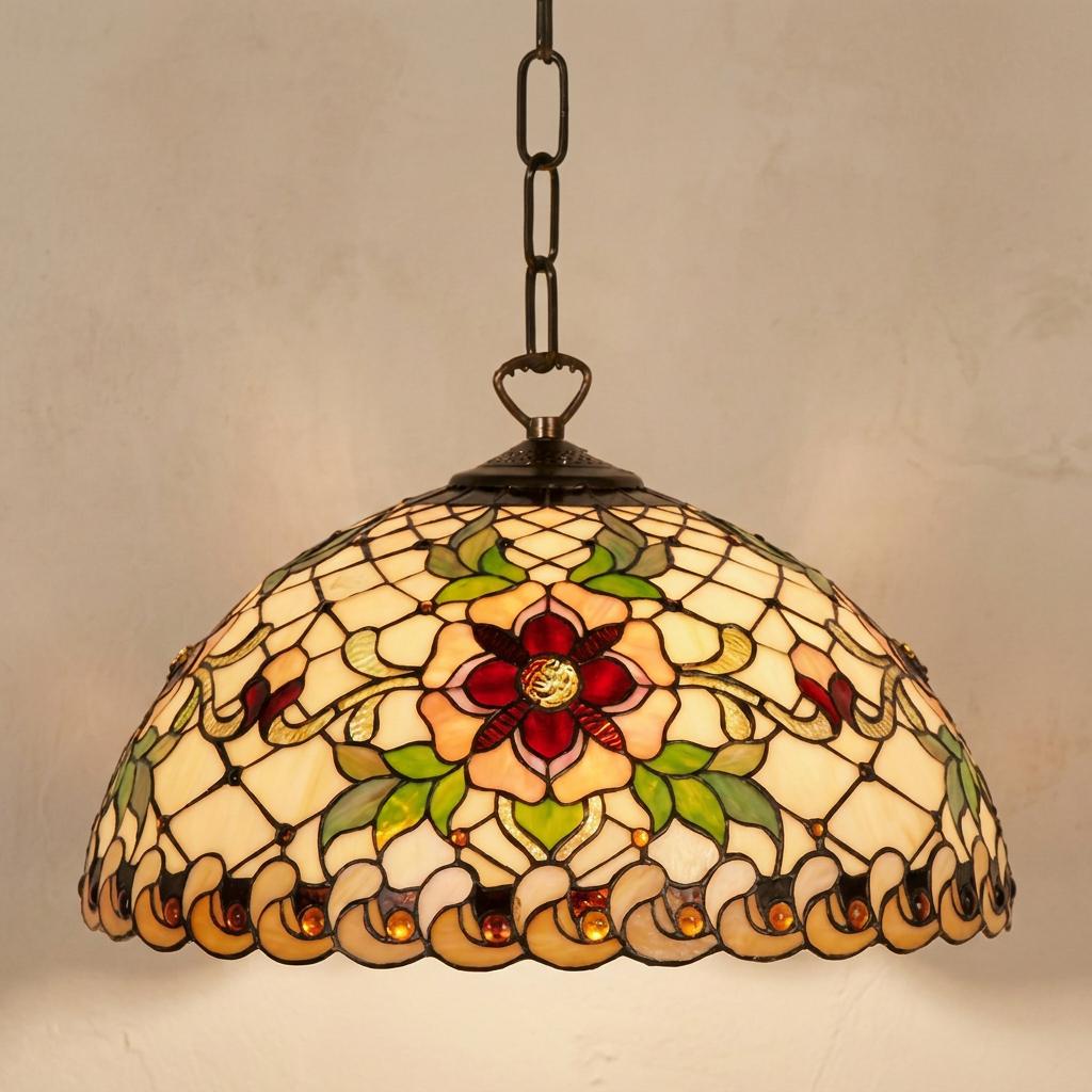 Angelique Small Tiffany pendant ceiling light with a floral stained glass shade hanging from a dark metal chain.