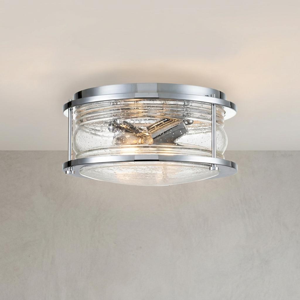 Ashland Bay polished chrome flush ceiling light with a seeded glass shade illuminated on a neutral ceiling.