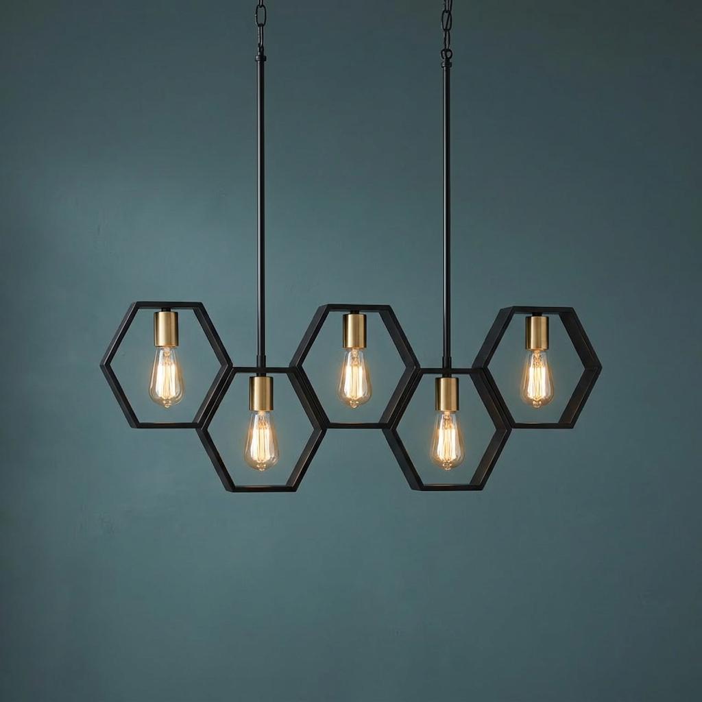 Five-light linear pendant with black hexagonal frames and Edison bulbs against a teal wall.