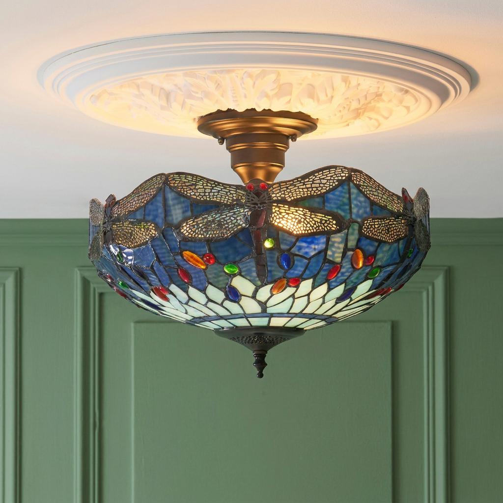 Semi-flush Tiffany ceiling light with blue dragonfly stained glass and jewels, mounted on an ornate white ceiling rose.