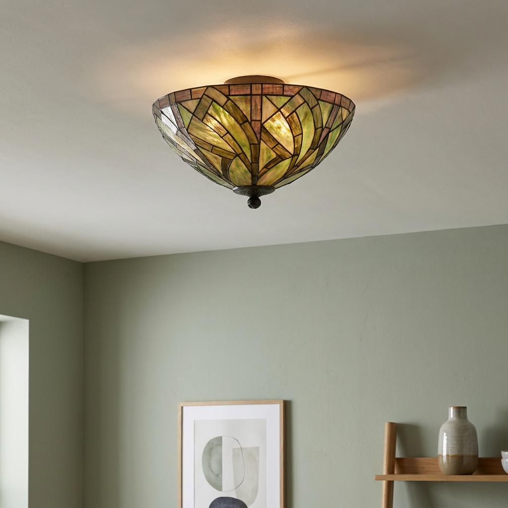 Bocastle Tiffany flush ceiling light with green and amber stained glass shade mounted in a sage green room.