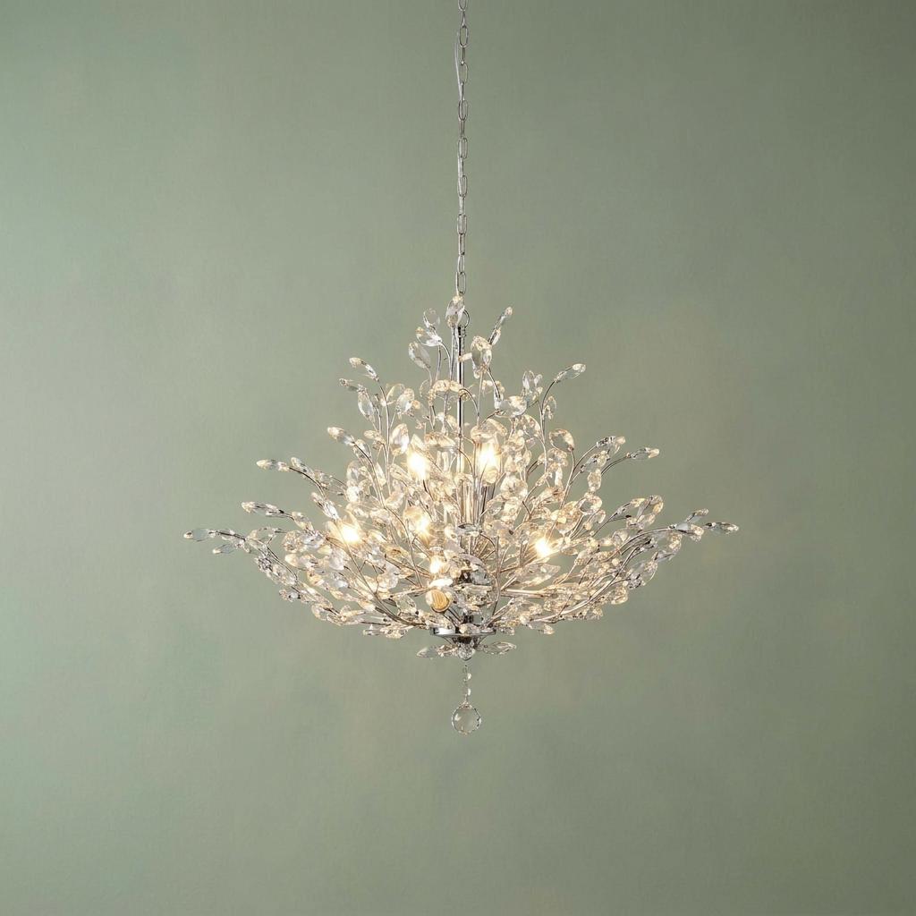 Bouquet 11 light chrome ceiling pendant with crystal glass leaf-like details against a sage green wall.