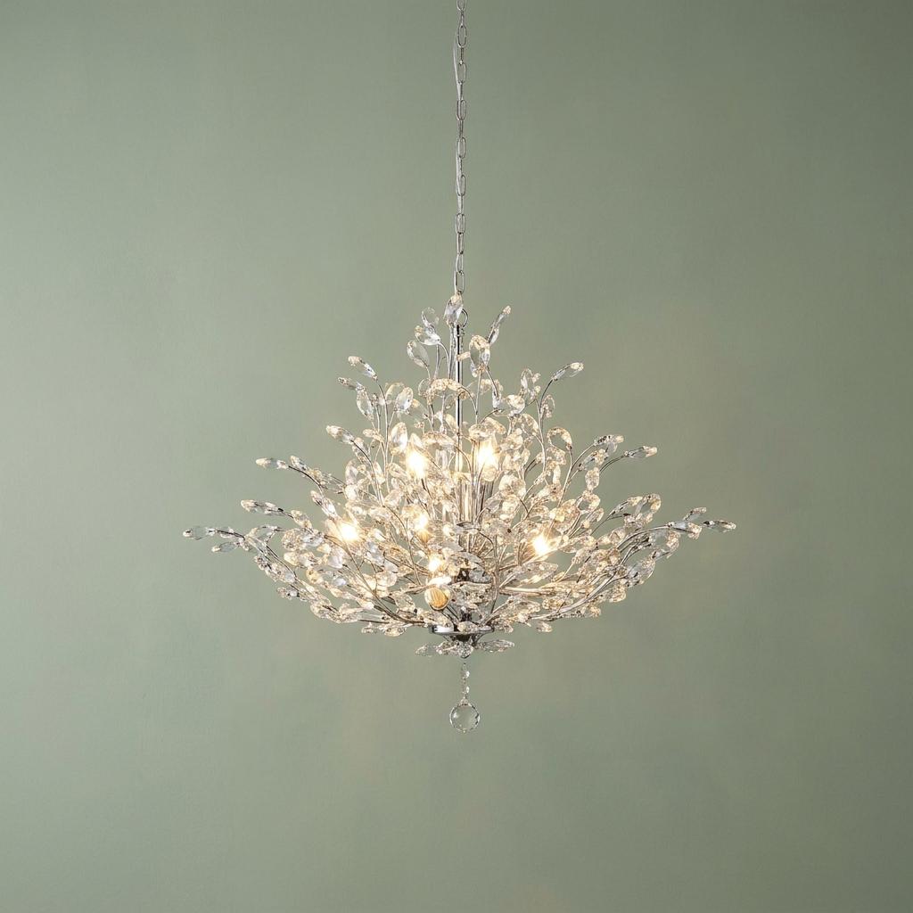 Lit Bouquet 11-light chrome ceiling pendant with crystal glass leaf accents against a sage green wall.