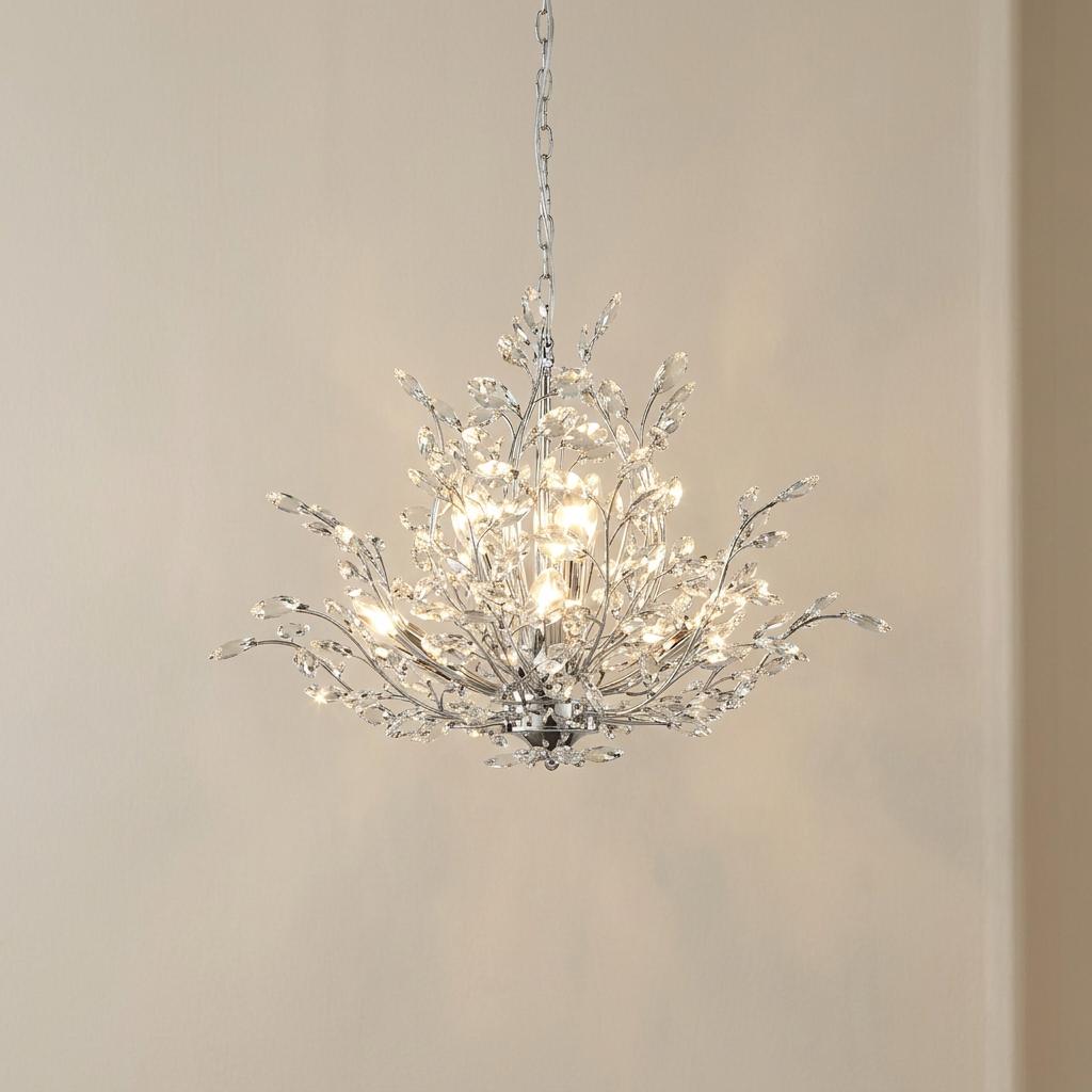 Bouquet 7 light chrome pendant with crystal glass leaf accents hanging against a neutral wall.