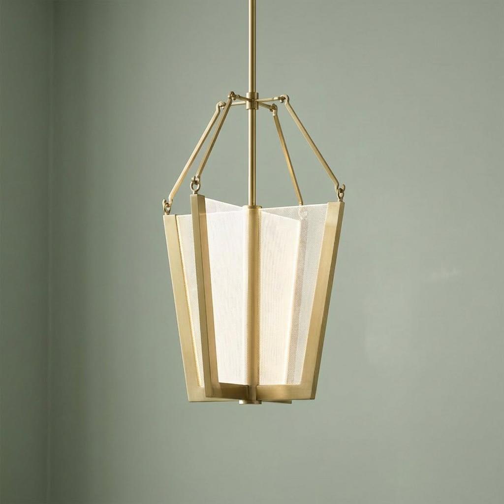 Modern Calters Medium LED Pendant with a brass frame and white mesh panels against a light green wall.