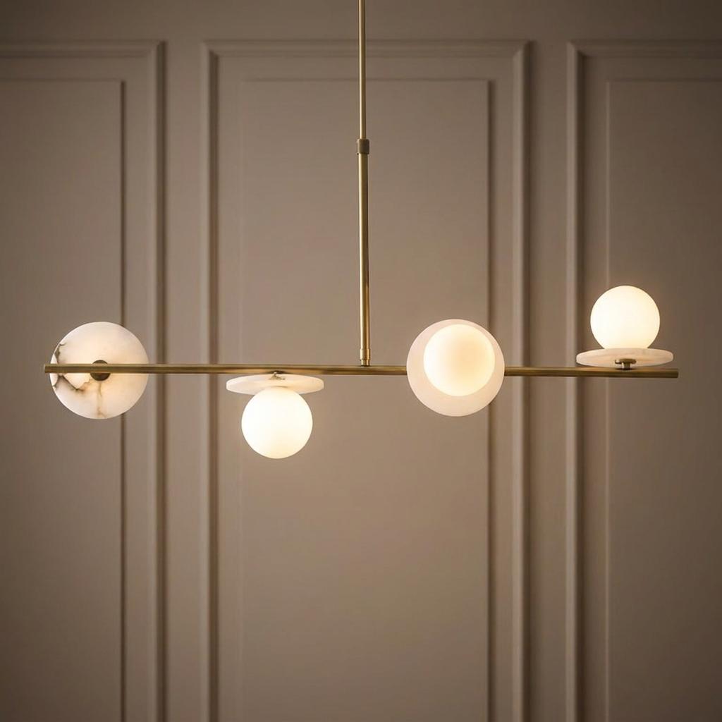 Cerchio 4 light brass and opal glass linear pendant against a paneled wall.