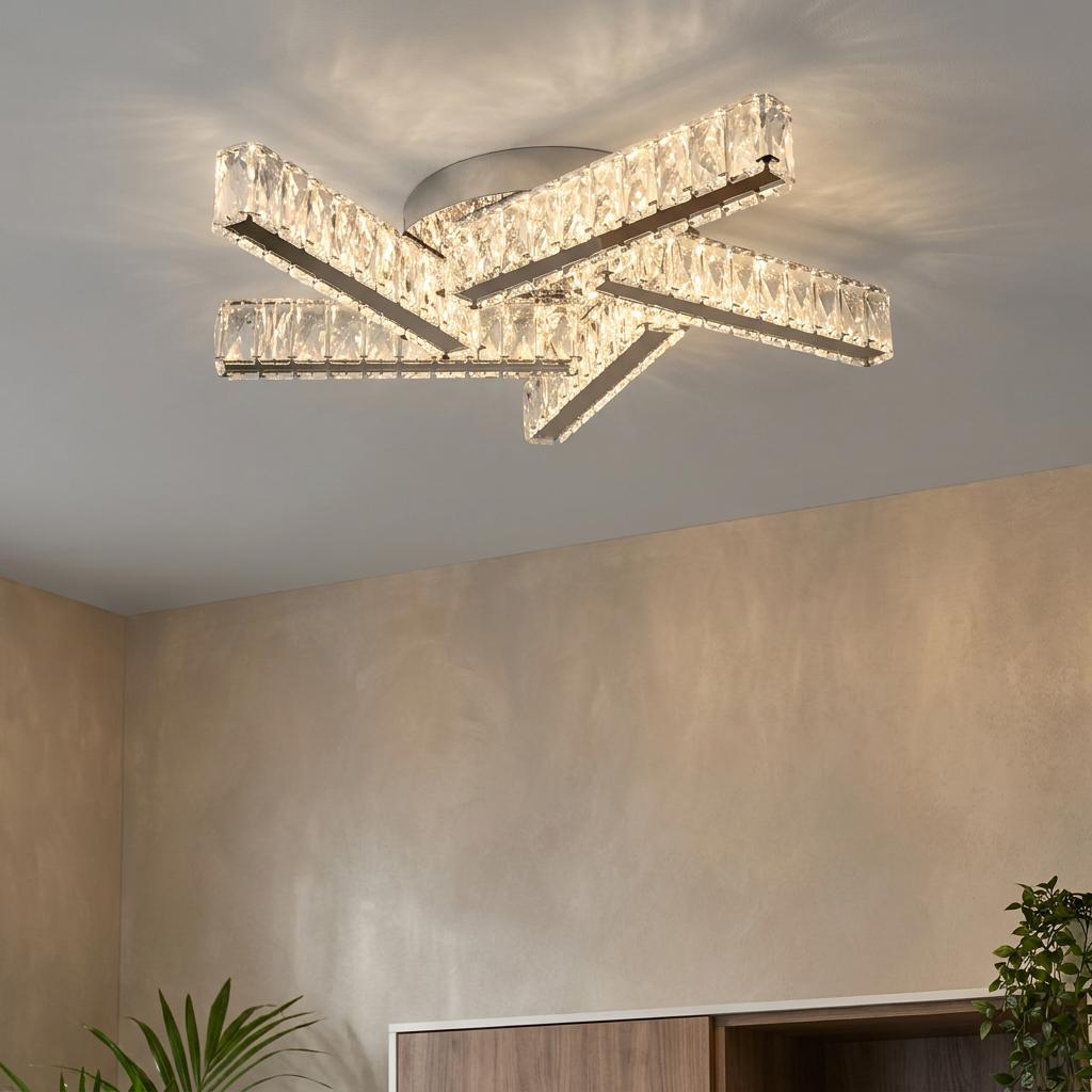 Modern Clover 5 light chrome flush ceiling light with intersecting crystal bars against a beige wall.