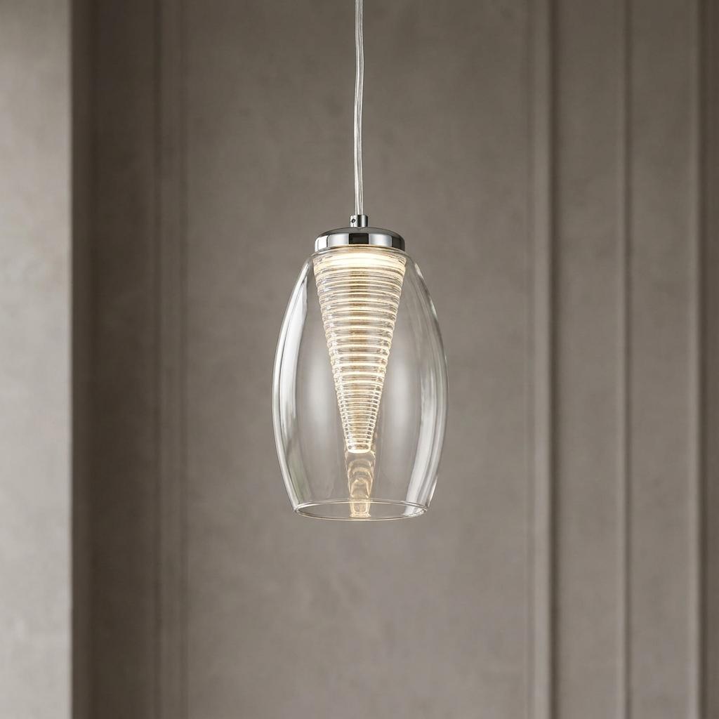 Clear oval glass pendant light with a ribbed conical inner diffuser against a neutral paneled wall.