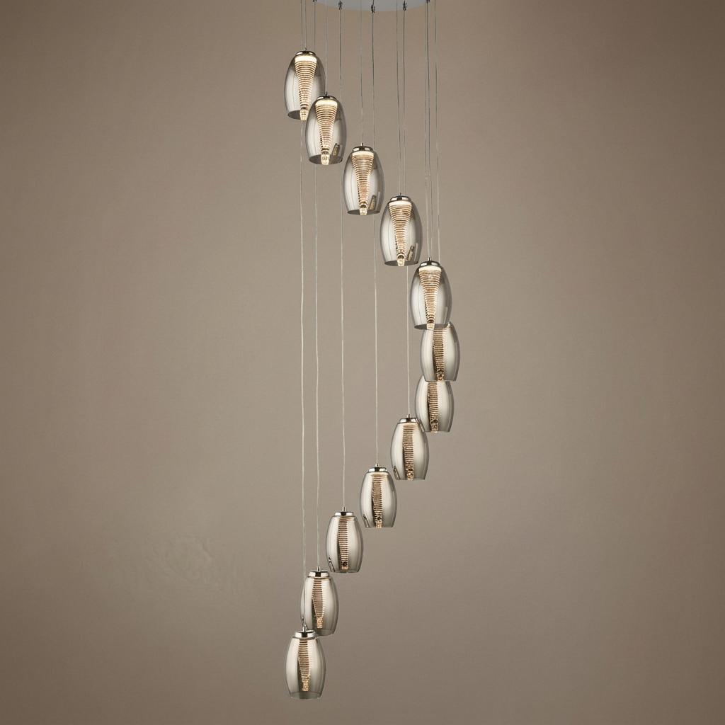 Twelve oval smoked glass pendants arranged in a cascading spiral formation.